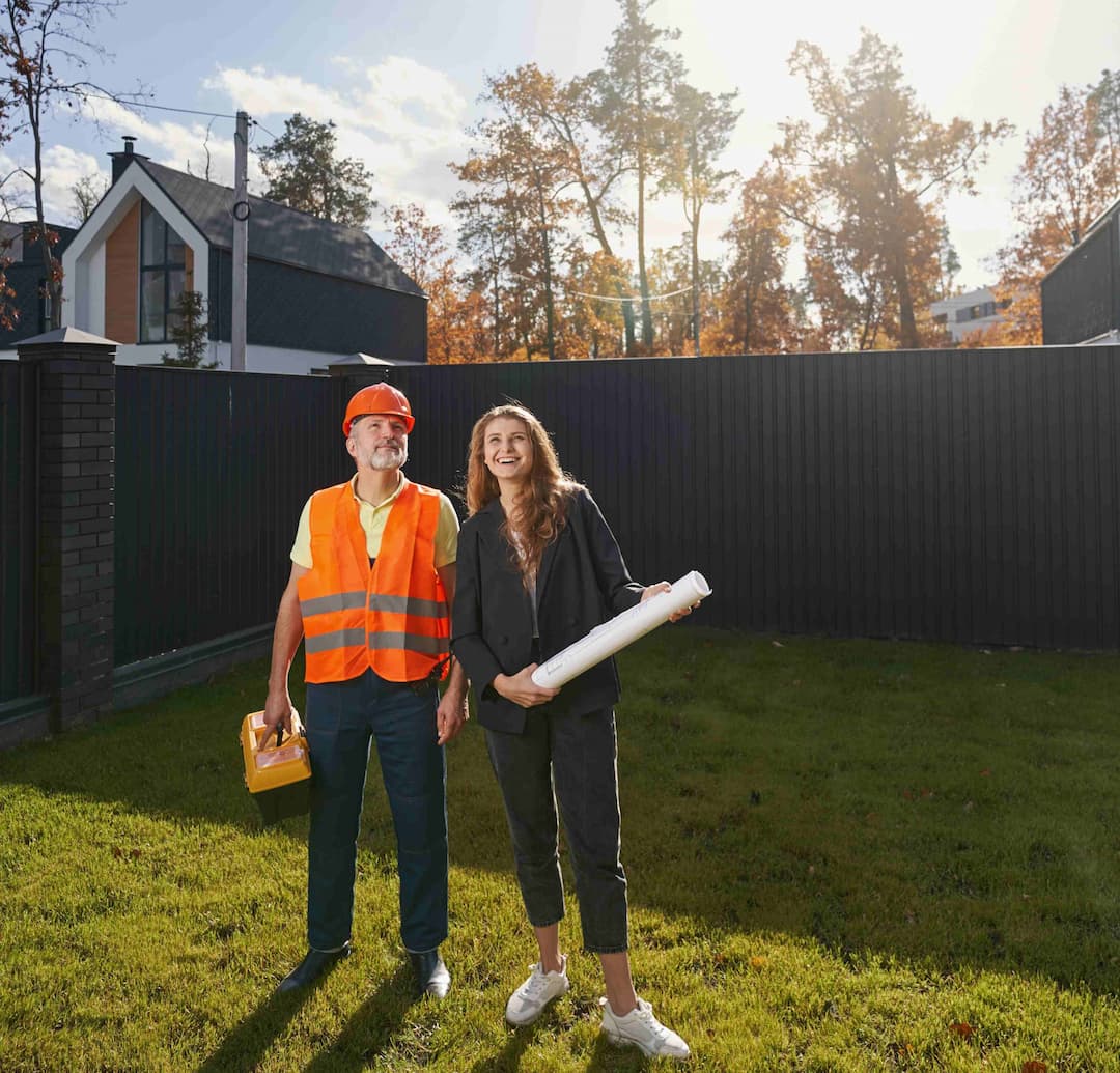 woman-civil-engineer-and-worker-standing-on-house